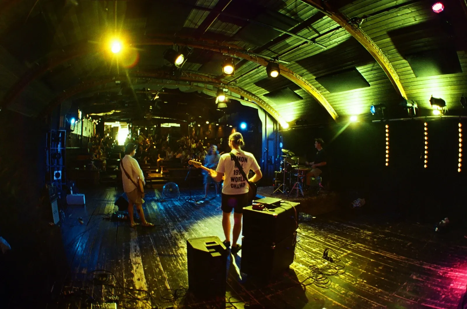 View from the stage past the bassist of Chroustones to the audience at Loď Tajemství